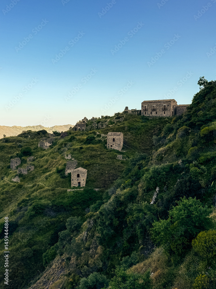 Fototapeta premium abandoned village on the green hill