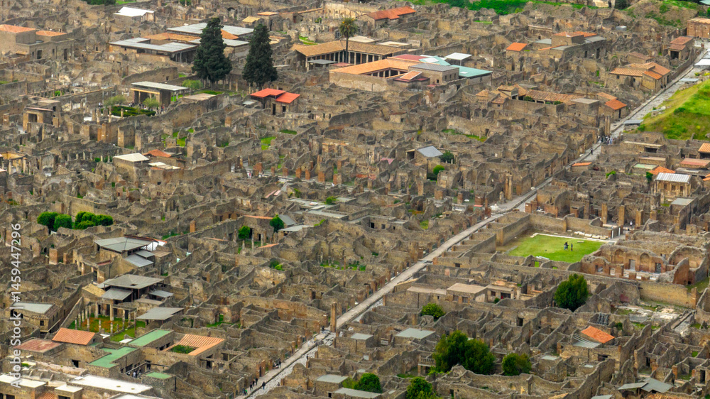 Aerial view of the archaeological park of Pompeii, located in the province of Naples, Campania, Italy. It is famous for the remains and ruins of the palaces and houses of an ancient Roman city.