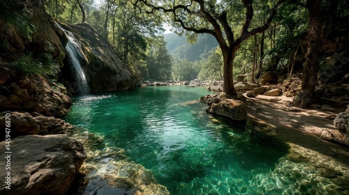 Tropical Waterfall Cascading into Turquoise Pool Surrounded by Lush Greenery - Serene Natural Landscape with Sunlight Dappled Effect.
