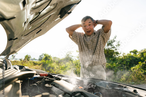 Photography Elderly man shocked by smoking car engine breakdown
