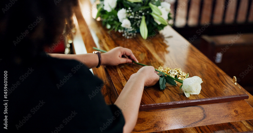 Naklejka premium Hands, woman and rose at funeral for farewell, mourning death and goodbye at burial ceremony. Sad, female person and rip with flowers for casket respect, memorial service and emotional for loss