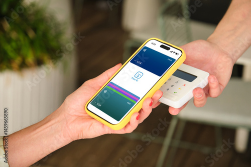 Obraz na płótnie Customer making a contactless payment using a smartphone and NFC technology w salonie
