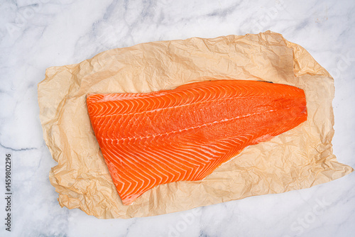 Obraz na płótnie Salmon. Fresh raw salmon fish fillet with cooking ingredients on white marble background, top view. High quality photo w salonie