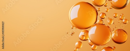 Amber oil droplets suspended in liquid on an orange background, creating a vibrant and abstract visual effect.