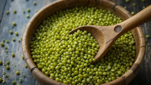Mung beans in wooden bowl with wooden spoon