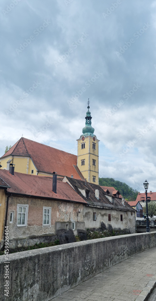 View of the Church of St. Anastasia in Samobor with its distinctive tower and surrounding buildings under an overcast sky