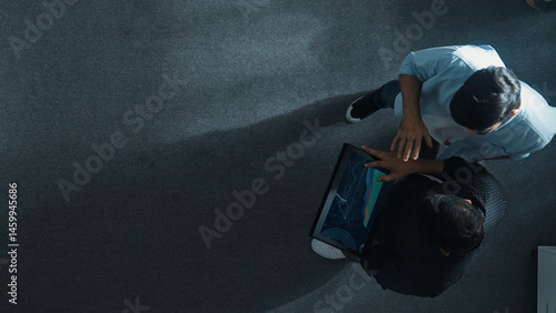Fotografia Top down view of manager walking to investor while holding tablet and looking at financial statistic