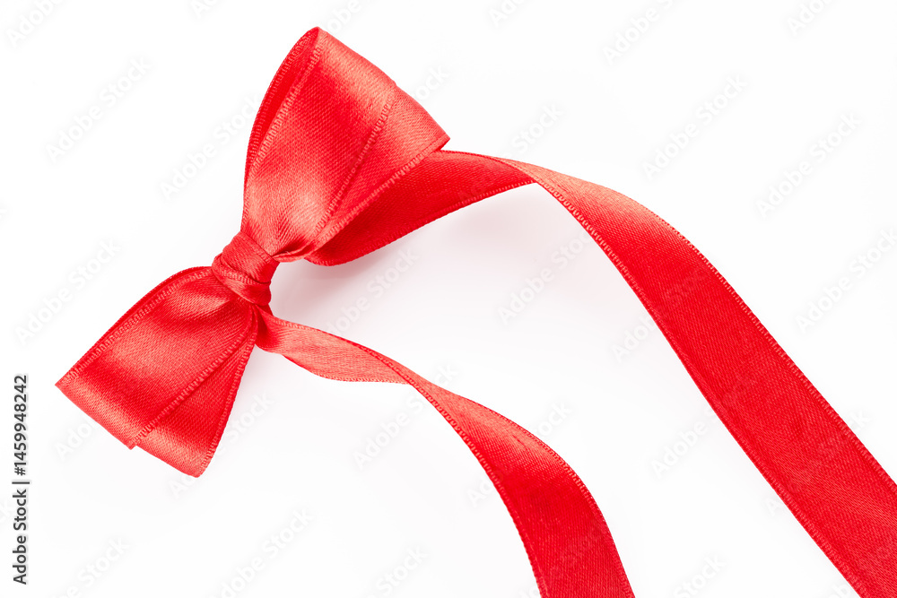 Red ribbon and bow on white background
