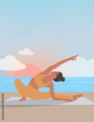 Woman doing yoga at sunset on the beach