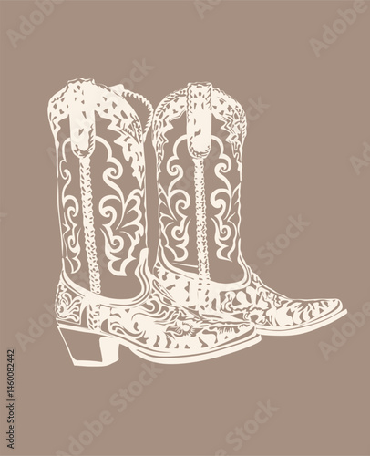 Pair of cowboy boots with a floral design on them. The boots are white and brown. The boots are on a tan background