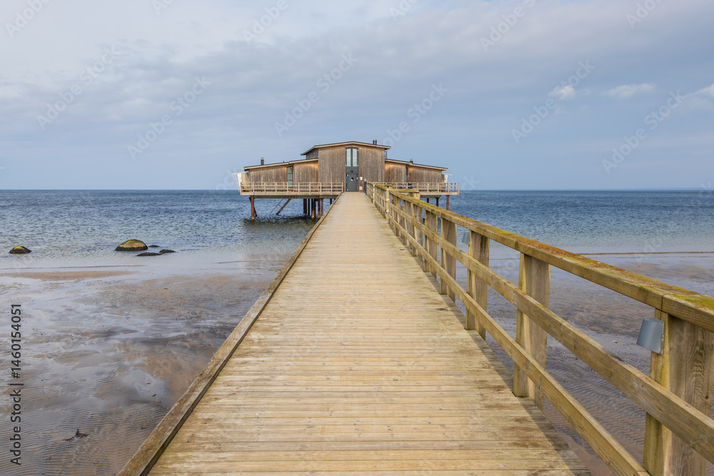 Fototapeta premium Wooden bathhouse on stilts over the sea in Torekov, Sweden.