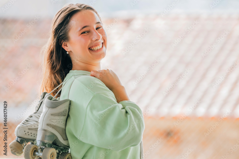 figure skating athlete with skates smiling outdoors