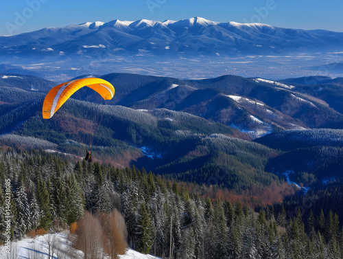 Paragliding Adventure over Snowy Mountain Range