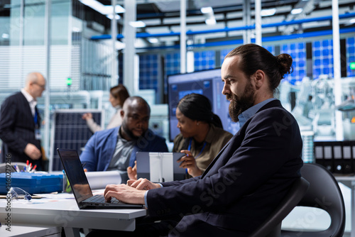 Obraz na płótnie Factory scientists doing research and development, working on manufacturing automation advancements. Industrial plant experts analyze technical data during meeting, doing strategic production planning w salonie
