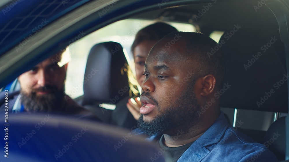 Happy customers shaking hands with car showroom salesman after finishing test drive and being satisfied. Clients reaching agreement with agent in dealership after driving vehicle, camera A