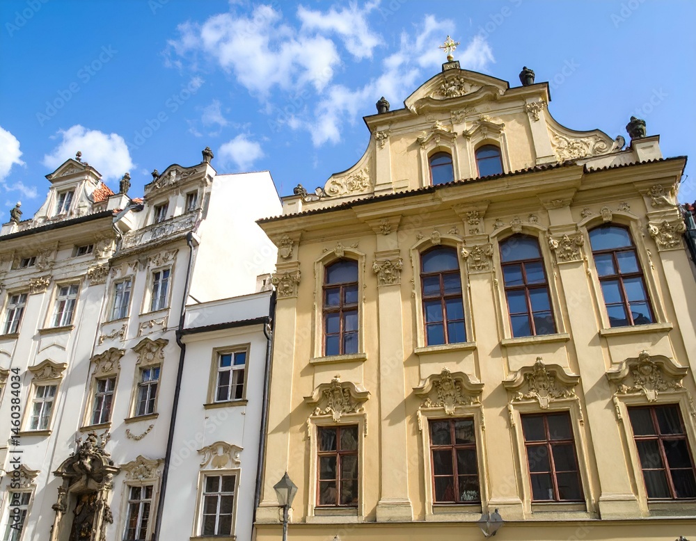 Two historic buildings in Prague, Czech Republic, showcasing intricate Baroque architecture, under a sunny sky. Two historic buildings in Prague, Czech Republic, showcasing intricate Baroque architecture, under a sunny sky.