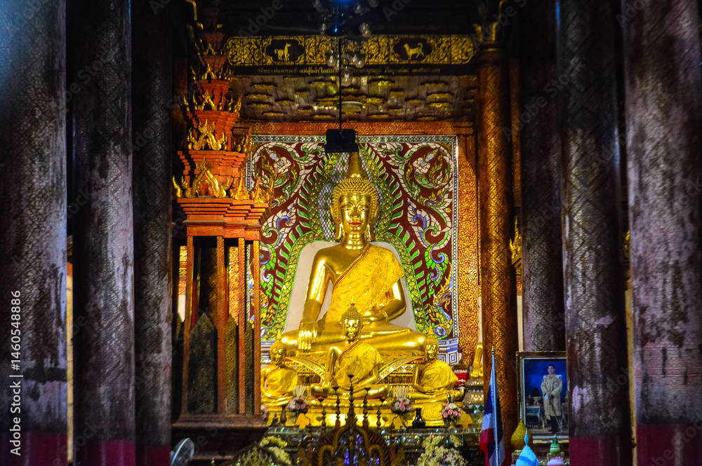Fototapeta premium Golden Buddha Statue, Symbols of Buddhism, South East Asia at Buak Krok Luang Temple, Chiang Mai, Northern Thailand