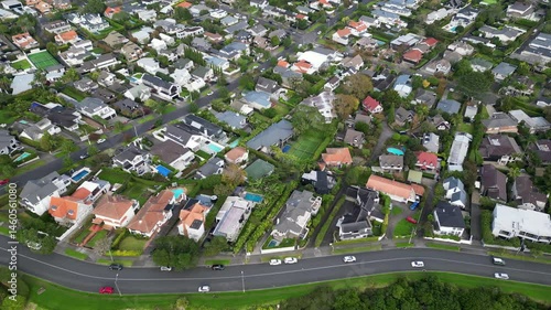 Drone aerial pan over Remuera and Orakei homes in Auckland, New Zealand. Urban living and residential layout.