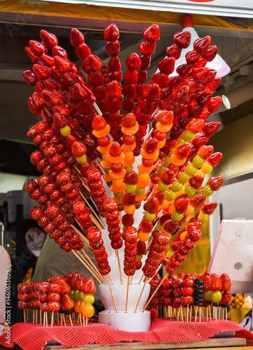 Photography Candied fruits on sticks at a street food stall in Shanghai, on historic Yunnan