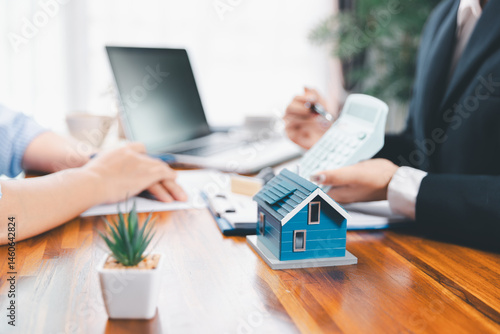 Bank approve loan to buy home concept. Real estate agent talked about terms of home purchase agreement, asked customer to sign documents to make contract legally. approved mortgage application form.