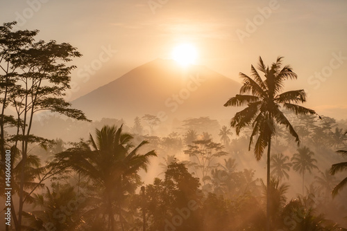 The sun rises over Mount Agung which is a photo from Gianyar