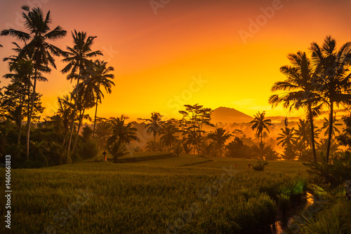 The sun rises over Mount Agung which is a photo from Gianyar