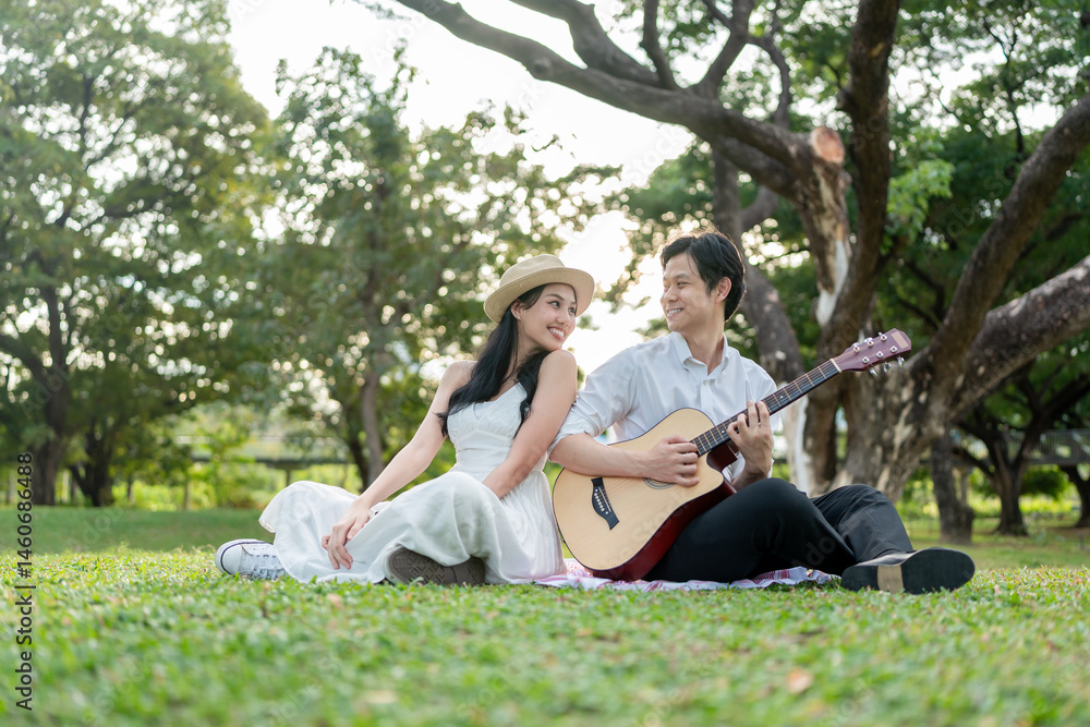 Asian young couple spend time on romantic date in the outdoors garden. Asian young couple spend time on romantic date in the outdoors garden.