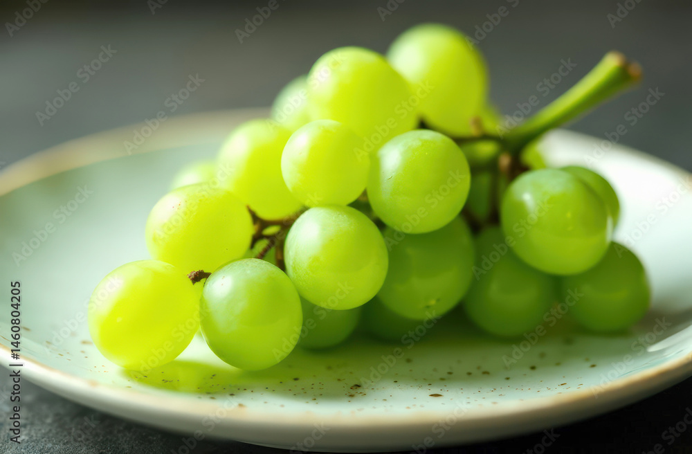 Fresh green grapes on a plate: luscious fruit display with vibrant colors Fresh green grapes on a plate: luscious fruit display with vibrant colors