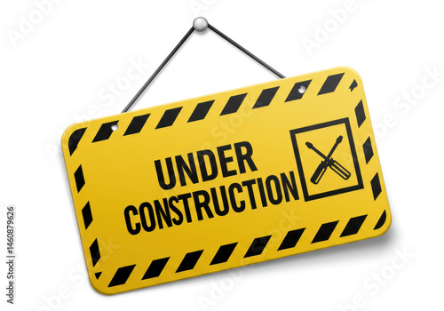 Under construction sign on wall.