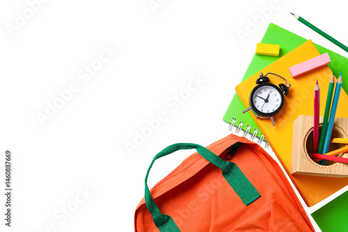 Photos Backpack and school supplies arranged for learning activities, isolated on white