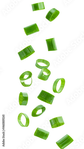 Freshly cut green onion slices falling on transparent background