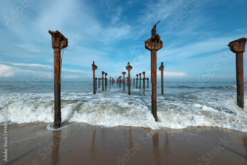 Old pier ruins extends to the sea beach view from the Venice of the East Alappuzha beach Kerala India. Famous destination of backwaters in Kerala top tourist places in Kerala.	