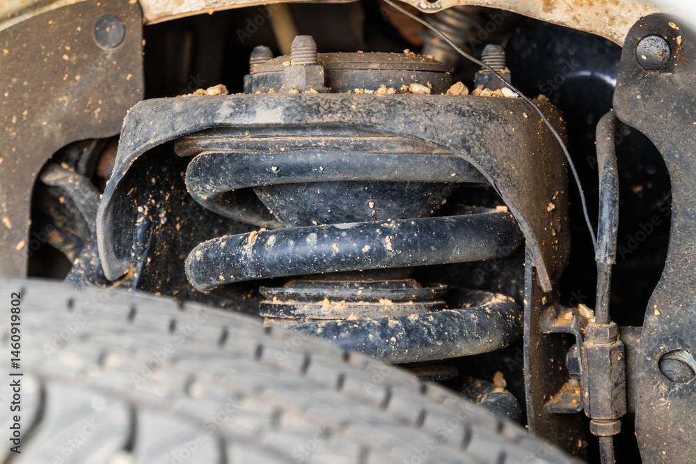 Vehicle suspension system close-up automotive workshop technical indoor detailed view