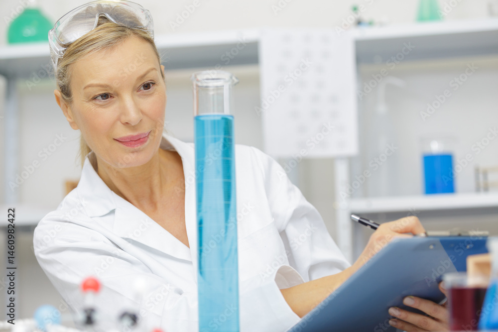 woman chemist making a mixture