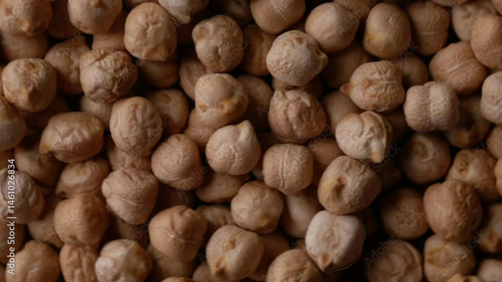 Raw Chickpeas on a rustic wooden table. Dry chickpea background close up. Chickpea legumes seed background. Raw Chickpeas on a rustic wooden table. Dry chickpea background close up. Chickpea legumes seed background.