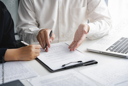 Real estate agent broker and customer with loan or insurance contract documents