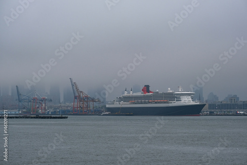 Obraz na płótnie Luxury ocean liner cruiseship cruise ship Queen Mary docked at terminal in Brooklyn on grey rainy cloudy misty day after Transatlantic Crossing in New York City w salonie
