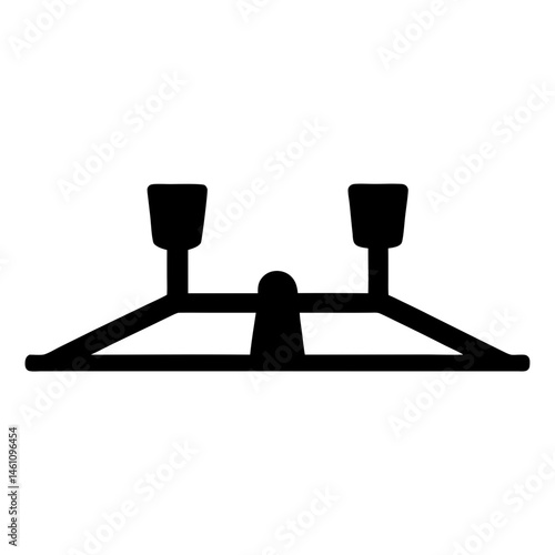 Abstract silhouette of a two cup candelabra with a centered base