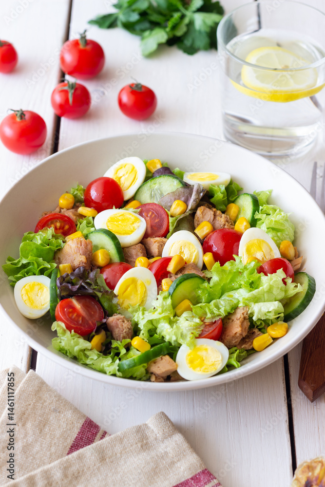 Salad with tuna, eggs, tomatoes, cucumbers and corn. Healthy eating. Diet. Salad with tuna, eggs, tomatoes, cucumbers and corn. Healthy eating. Diet.