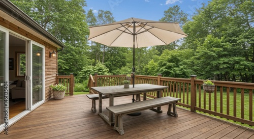 Outdoor dining set on a wooden deck with umbrella