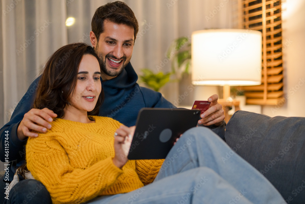 Love at Home: Couples and Technology. Smiling duo enjoys modern lifestyle on digital gadgets.
Love at Home: Couples and Technology. Smiling duo enjoys modern lifestyle on digital gadgets.
