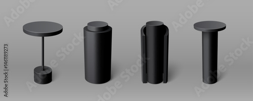 Black podium set - tall round cylindrical pedestals of different shapes. Simple geometric stages with smooth matte surfaces for product display or exhibition design. Minimalist monochrome style.