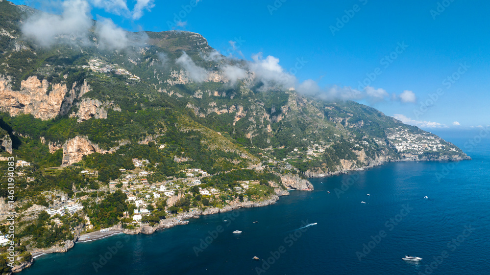 Aerial view of the Amalfi Coast, in the province of Salerno, Campania, Italy. This coastal panorama is one of the most beautiful and touristic on the Italian peninsula. In background it's Praiano town