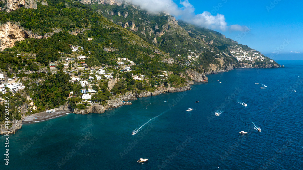 Aerial view of the Amalfi Coast, in the province of Salerno, Campania, Italy. This coastal panorama is one of the most beautiful and touristic on the Italian peninsula. In background it's Praiano town