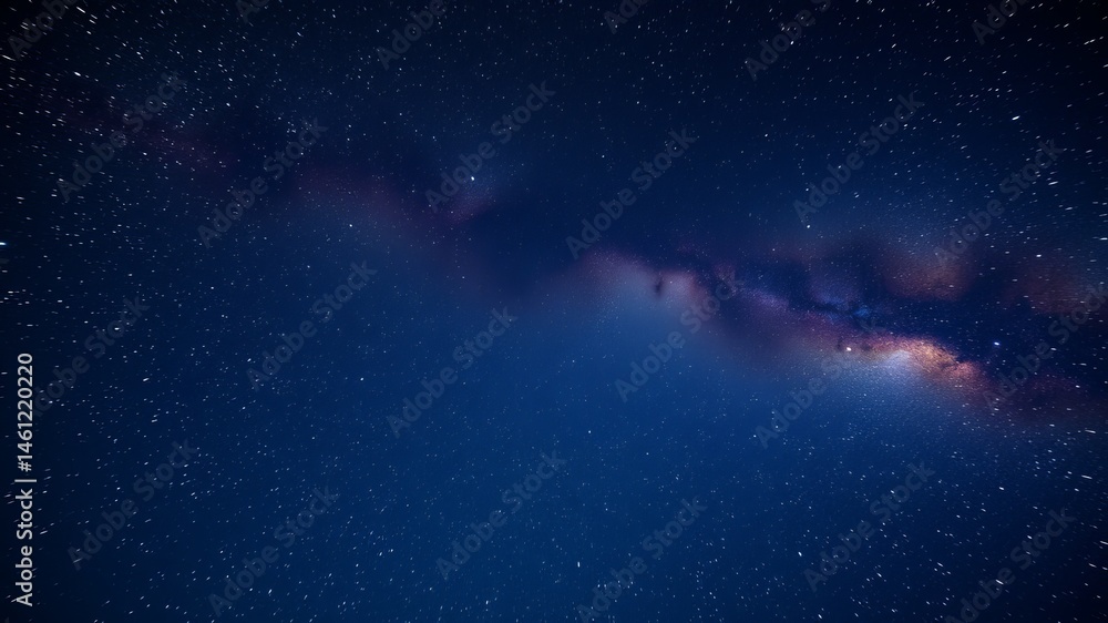 Fototapeta premium A breathtaking panoramic view of the Milky Way galaxy stretches across a dark night sky filled with countless stars.
