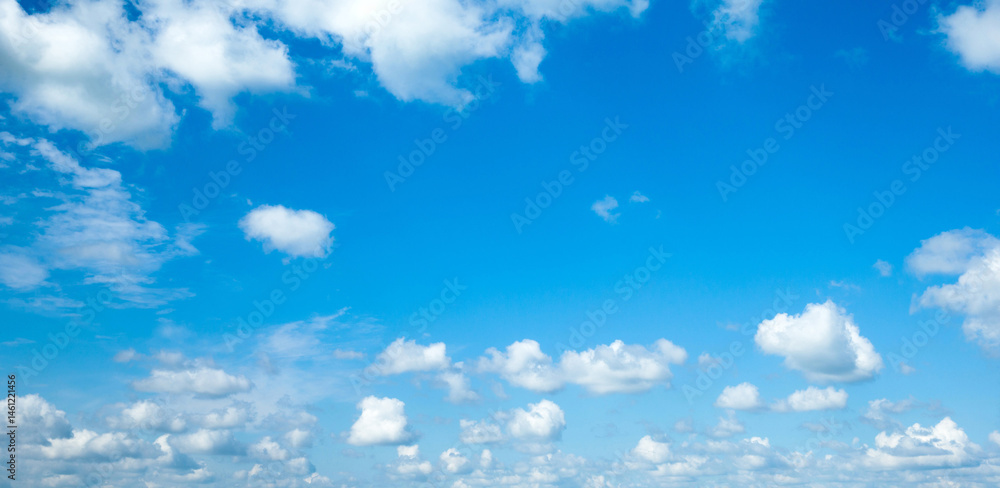 blue sky background with tiny clouds