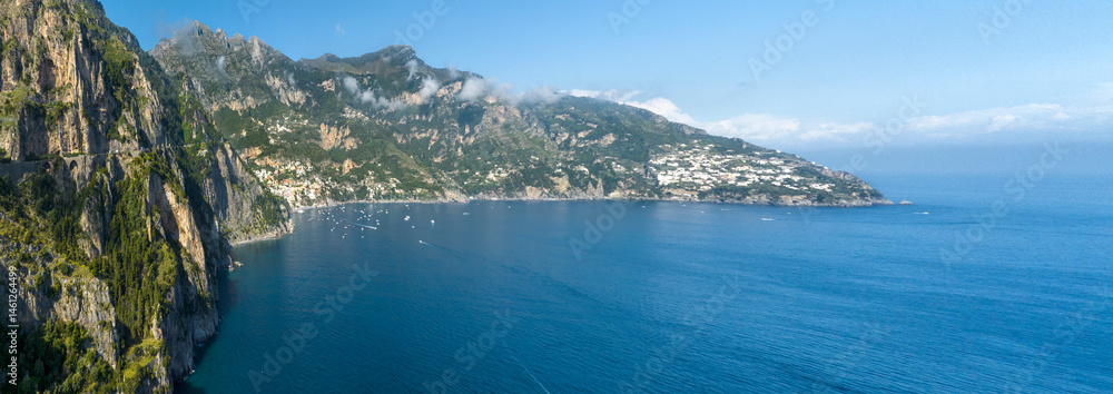 Panoramic aerial view of the Amalfi Coast, in the province of Salerno, Campania, Italy. In the center of the panorama there is the town of Positano, one of the most touristic and beutiful destinations