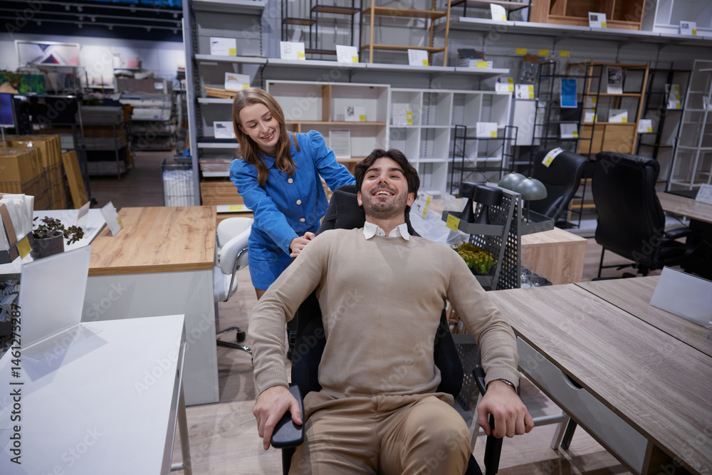 Two people relax in stylish office furniture showroom showcasing modern designs