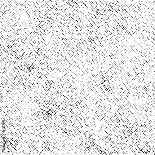 A dense of small scattered black dots covers a white background.