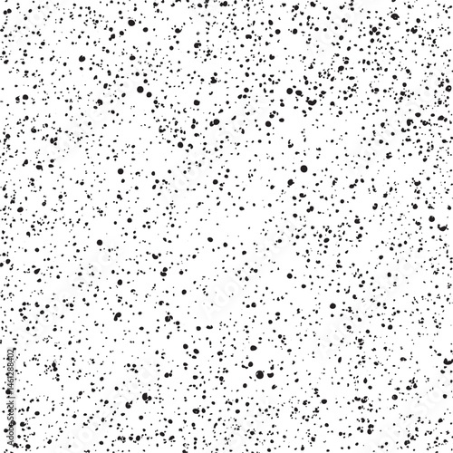 A seamless white and black speckled background texture.